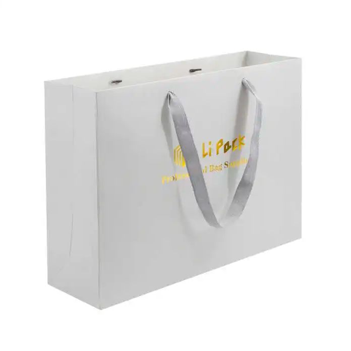 White Shopping Paper Bags for Boutique Retail Logo Print with Gold Stamp And Ribbon Handles